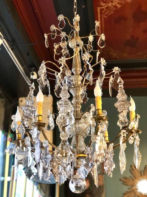 Large chandelier with tassels and old daggers