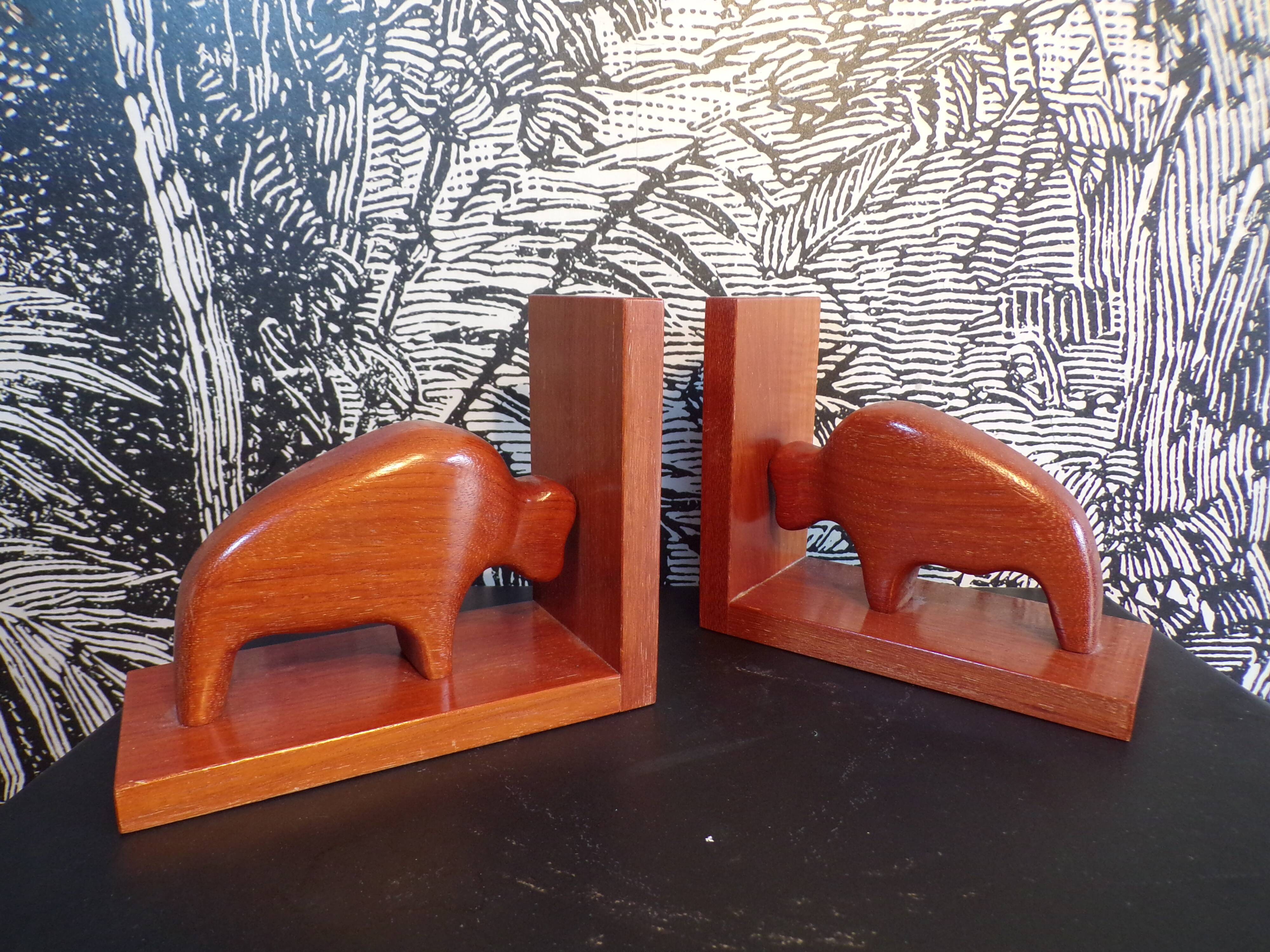 Pair of teak bookends in the shape of a bison