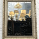 Mirror in a frame with a moulding.