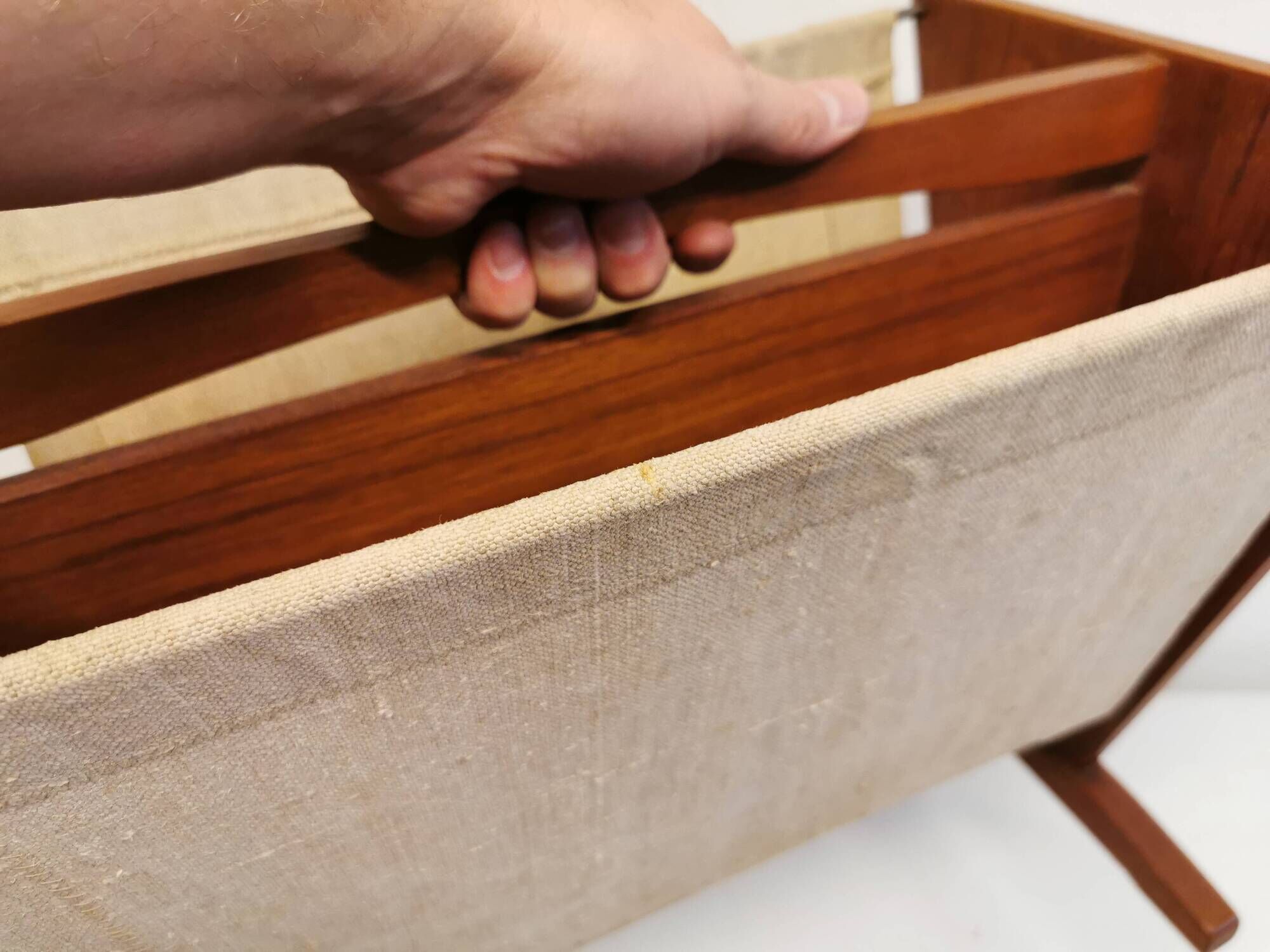 Magazine rack in teak wood with sand-coloured canvas, Danish and from the 1970s.