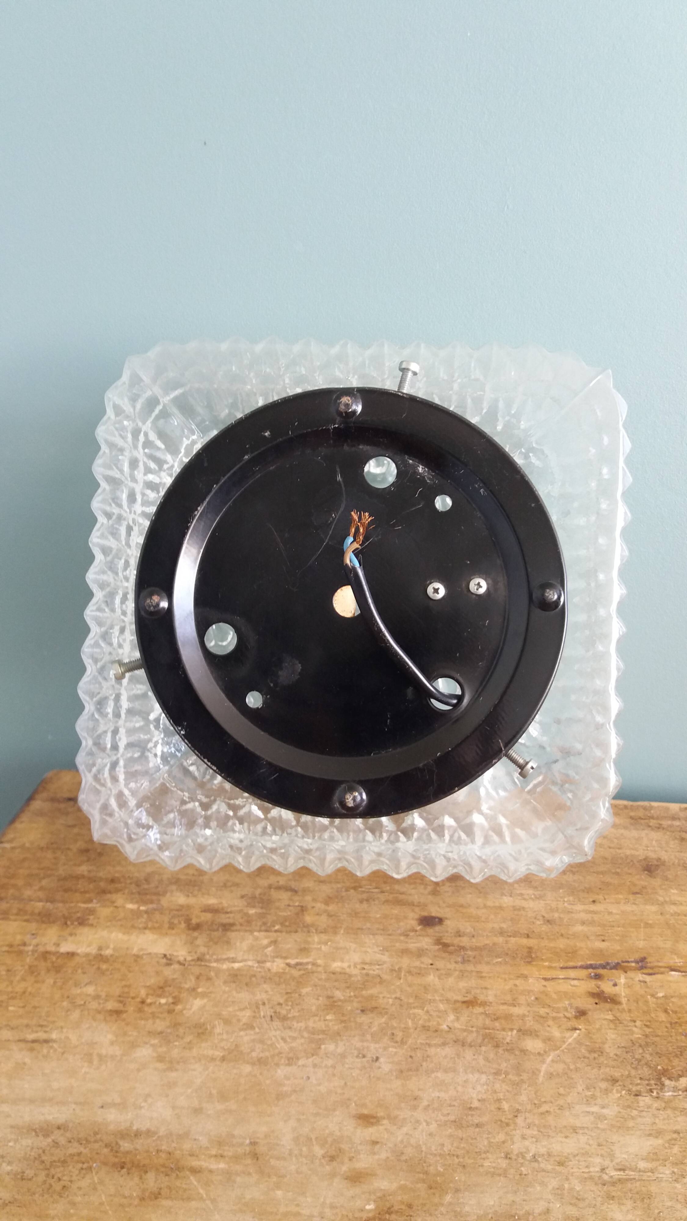 Square globe ceiling light in moulded glass.