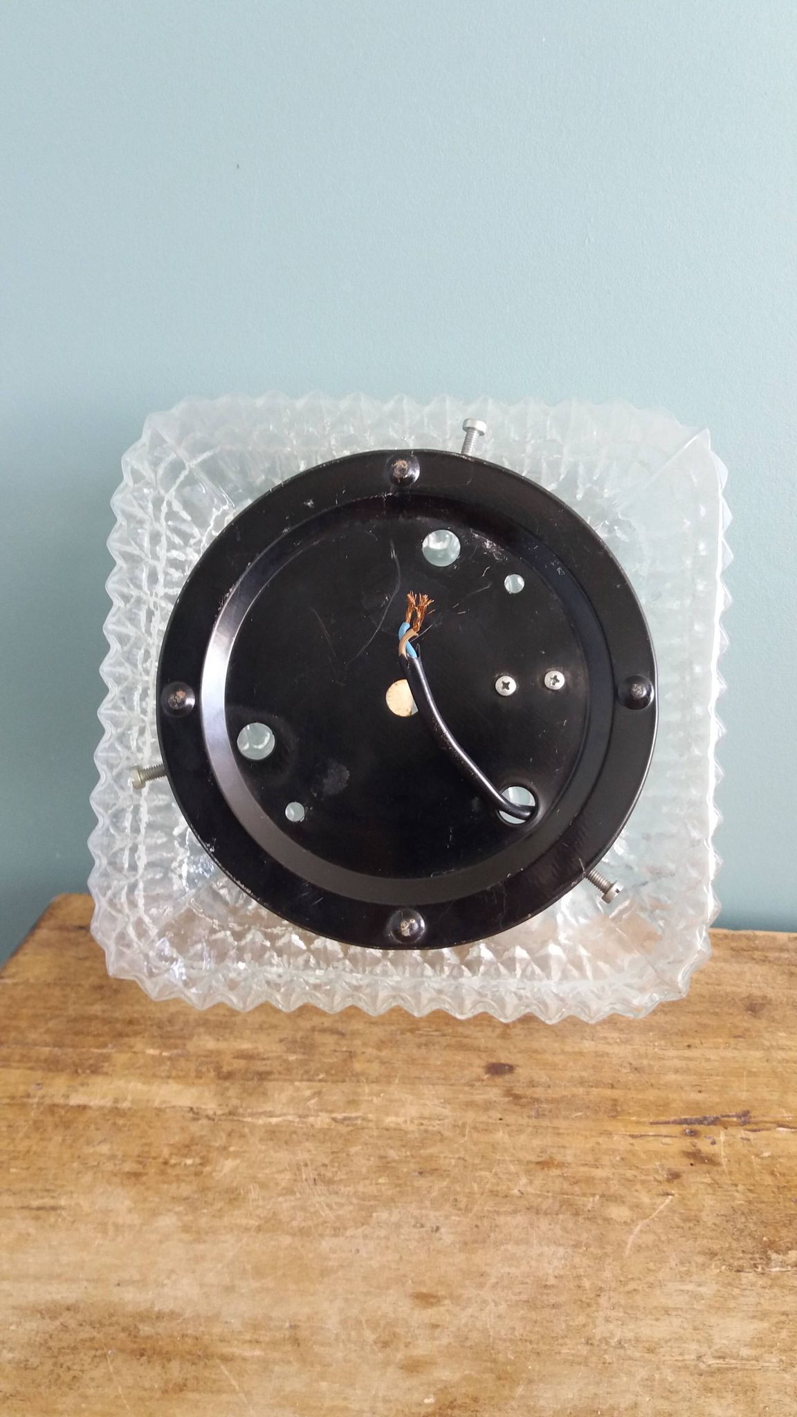 Square globe ceiling light in moulded glass.