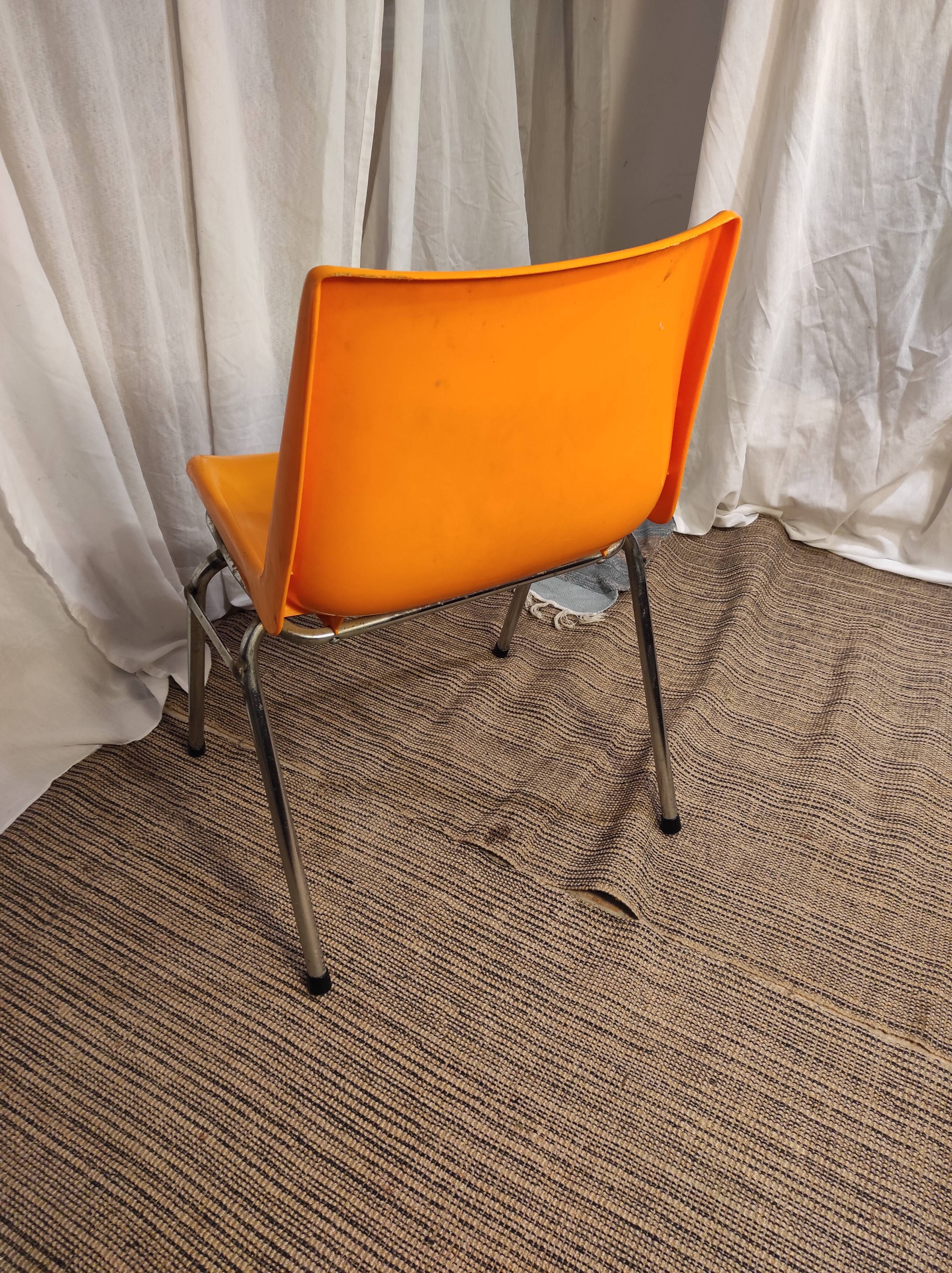 Orange plastic chair 1970