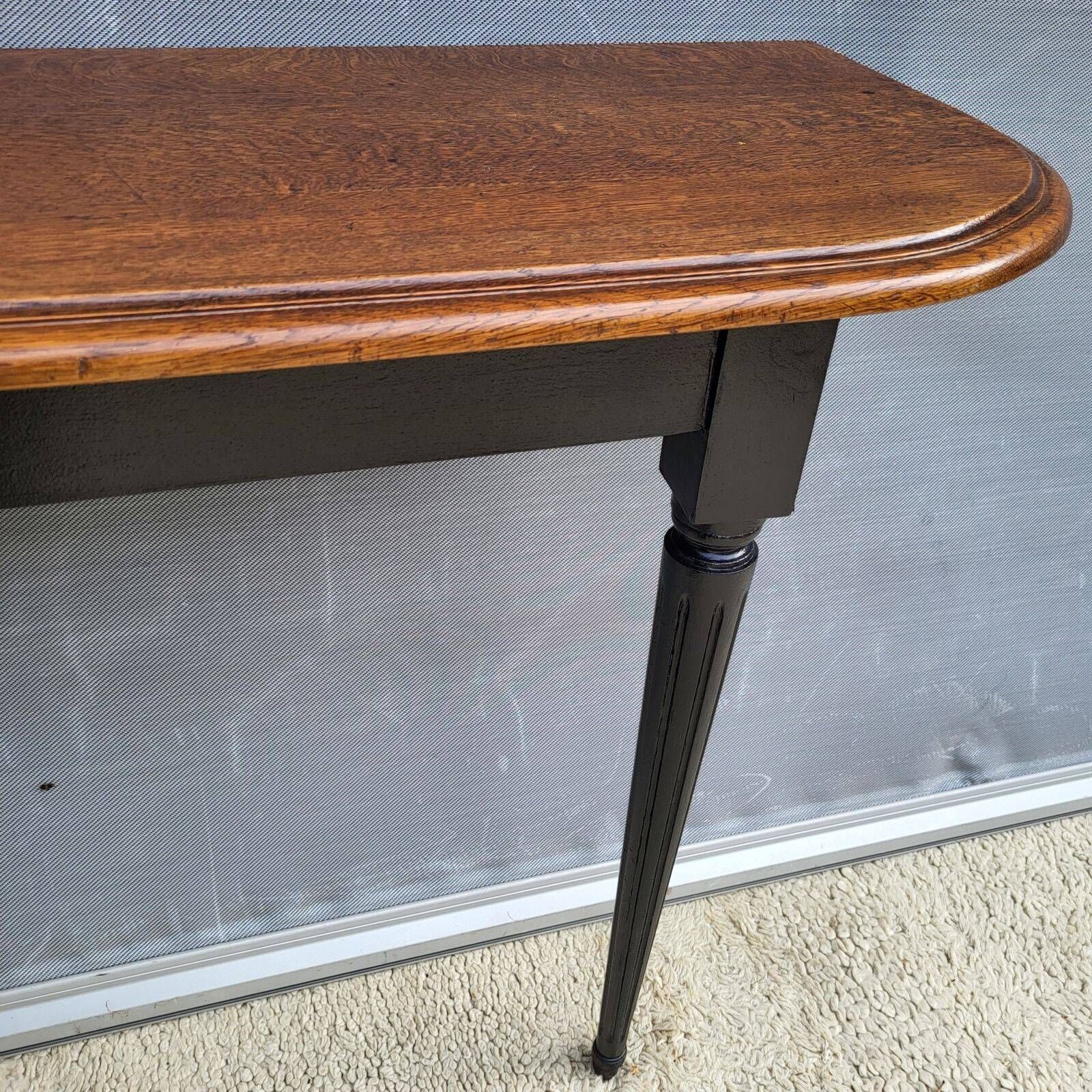 Console bicolore noire et chêne style Louis XVI restaurée