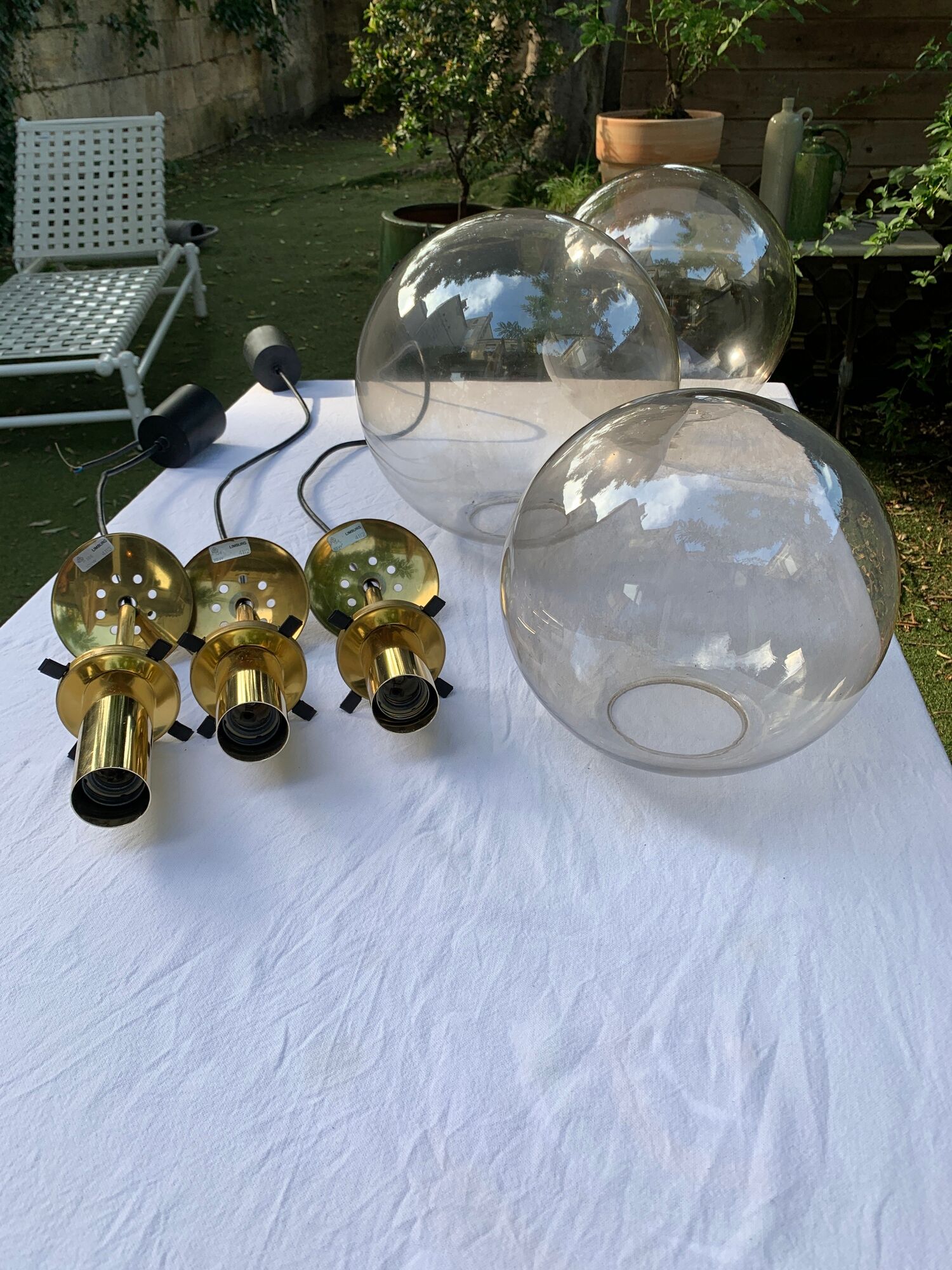 Set of three suspensions in glass and brass Limburg 70s