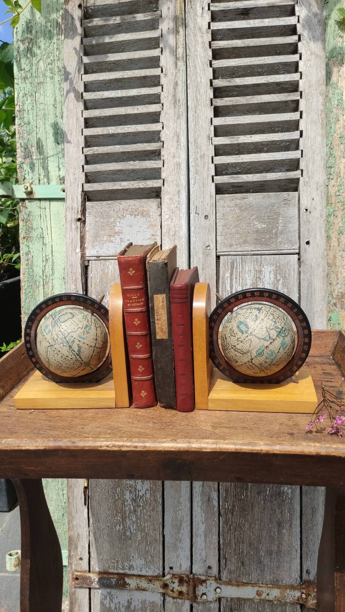 Pair of greenhouses vintage wooden books world map