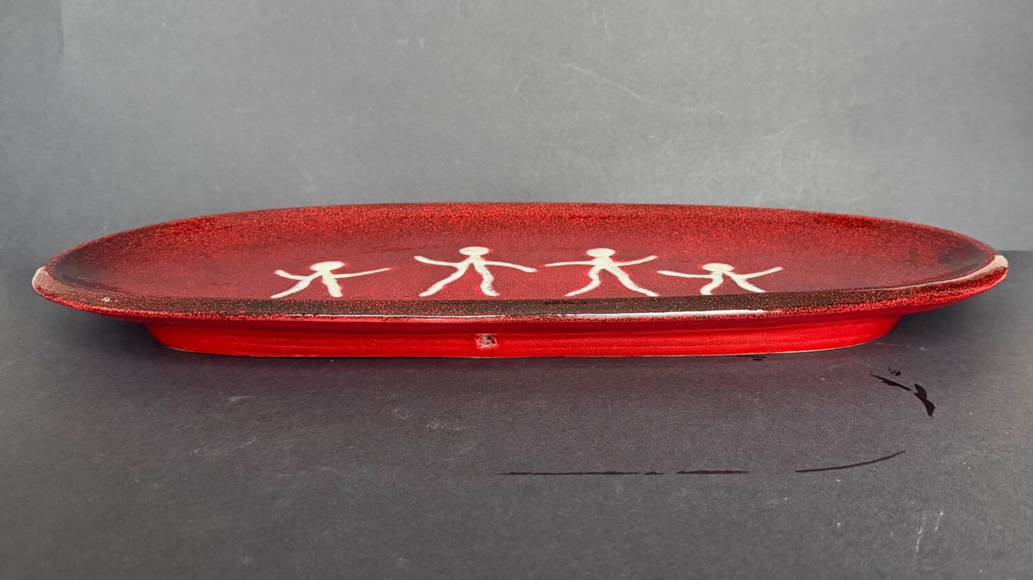 Large red ceramic dish