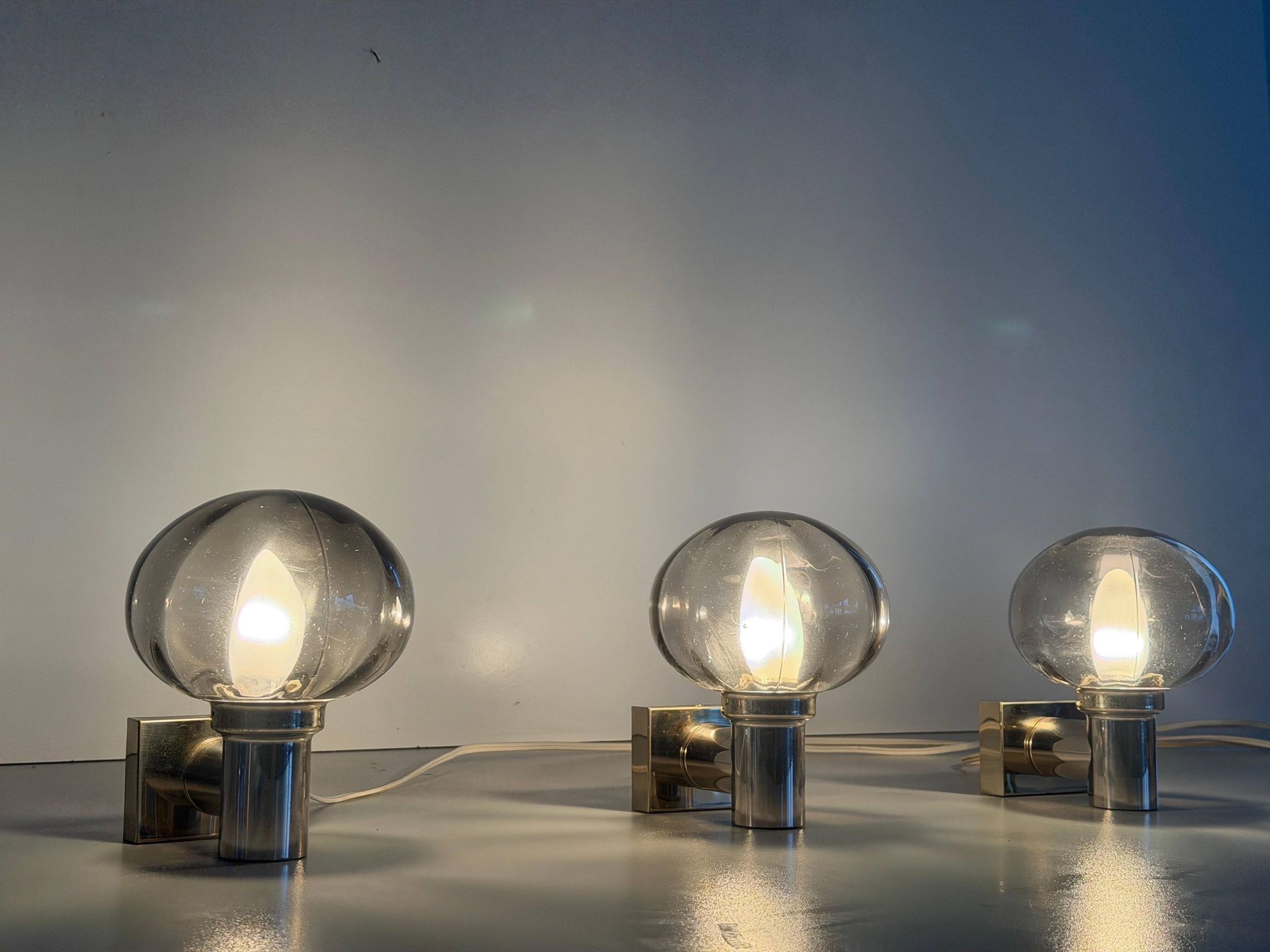 Set of 3 grey glass and chrome wall lights from the mid-century by N Leuchten, 1960s, Germany.