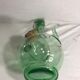 Old refreshing carafe pourer in green blown glass with vintage cap