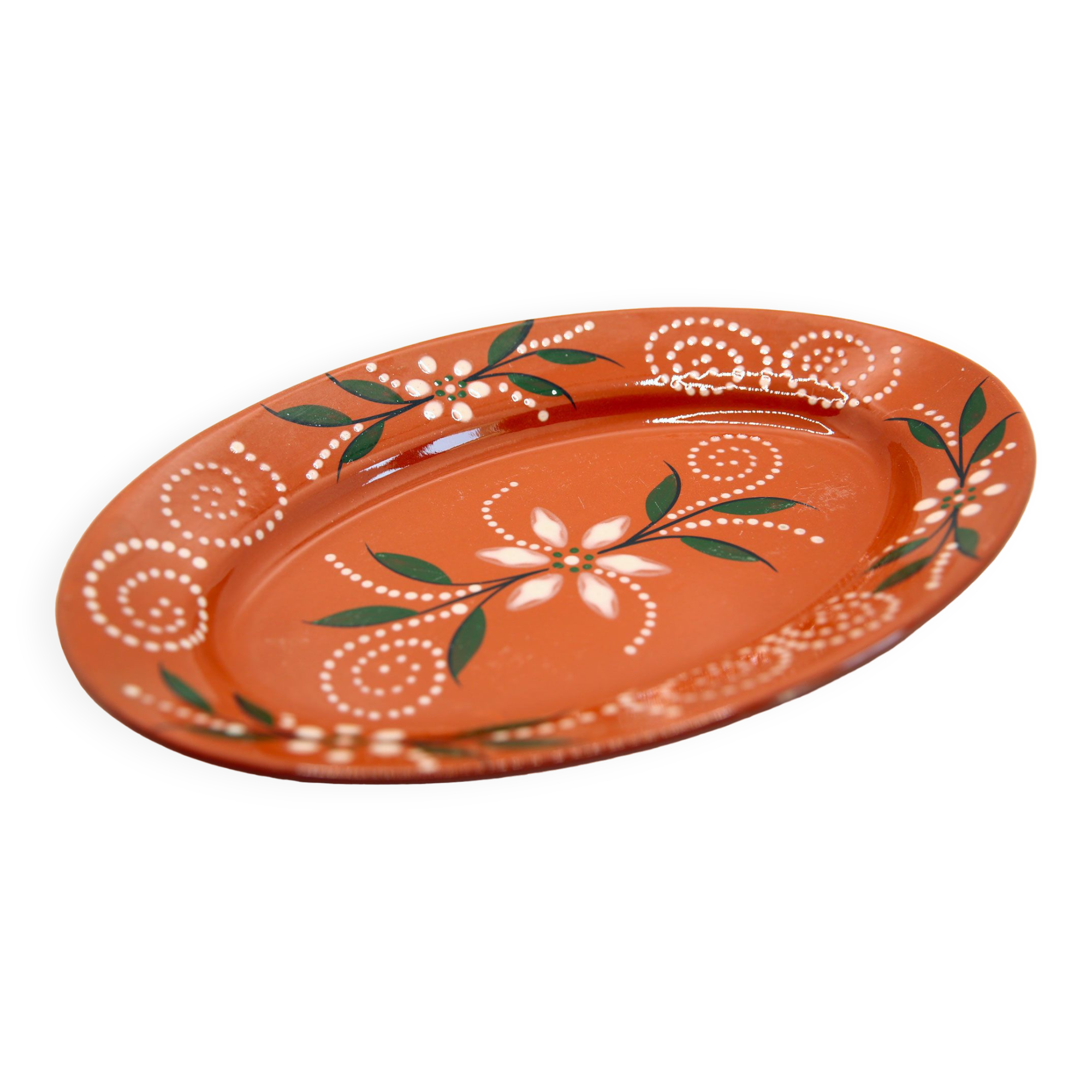 Portuguese XL dish in orange enamelled clay with unbleached flowers and green leaves