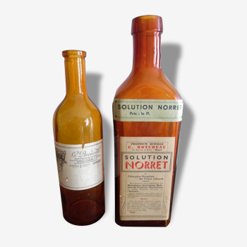 Two bottles of pharmacy with labels