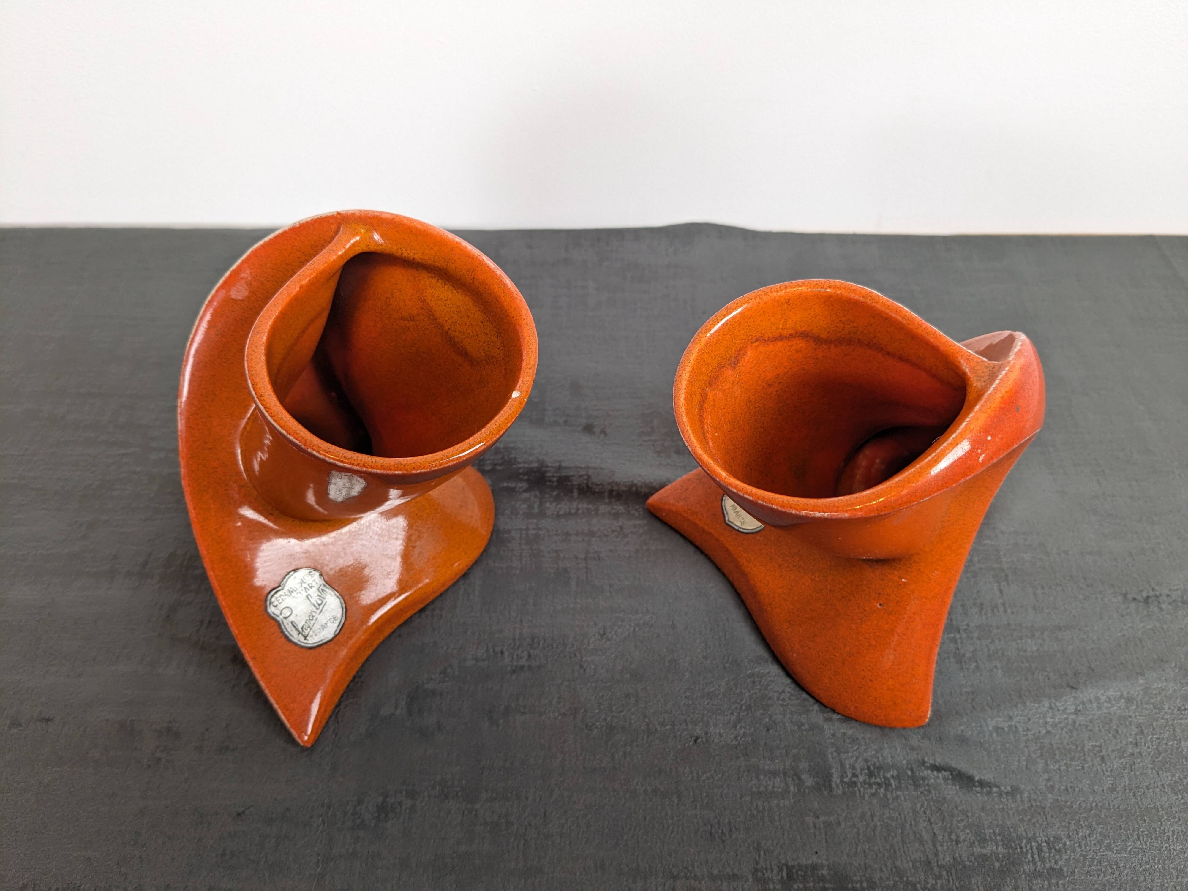 Pair of orange ceramic flower girls by Francis Lovas