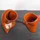 Pair of orange ceramic flower girls by Francis Lovas