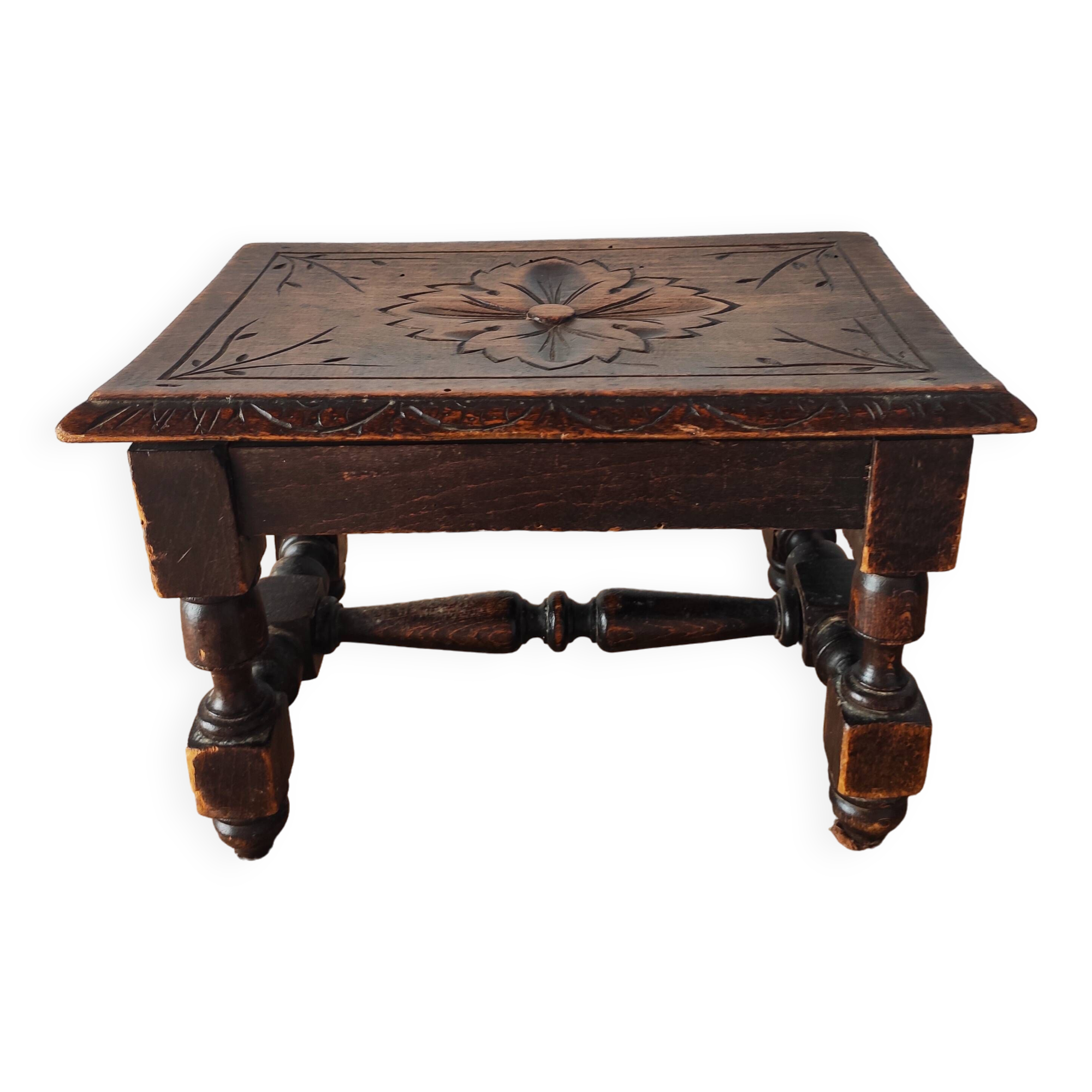 Old carved wooden footrest