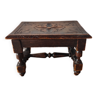 Old carved wooden footrest