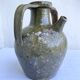 Ancient oil jar in glazed terracotta, khaki green — Auvergne, Lezou