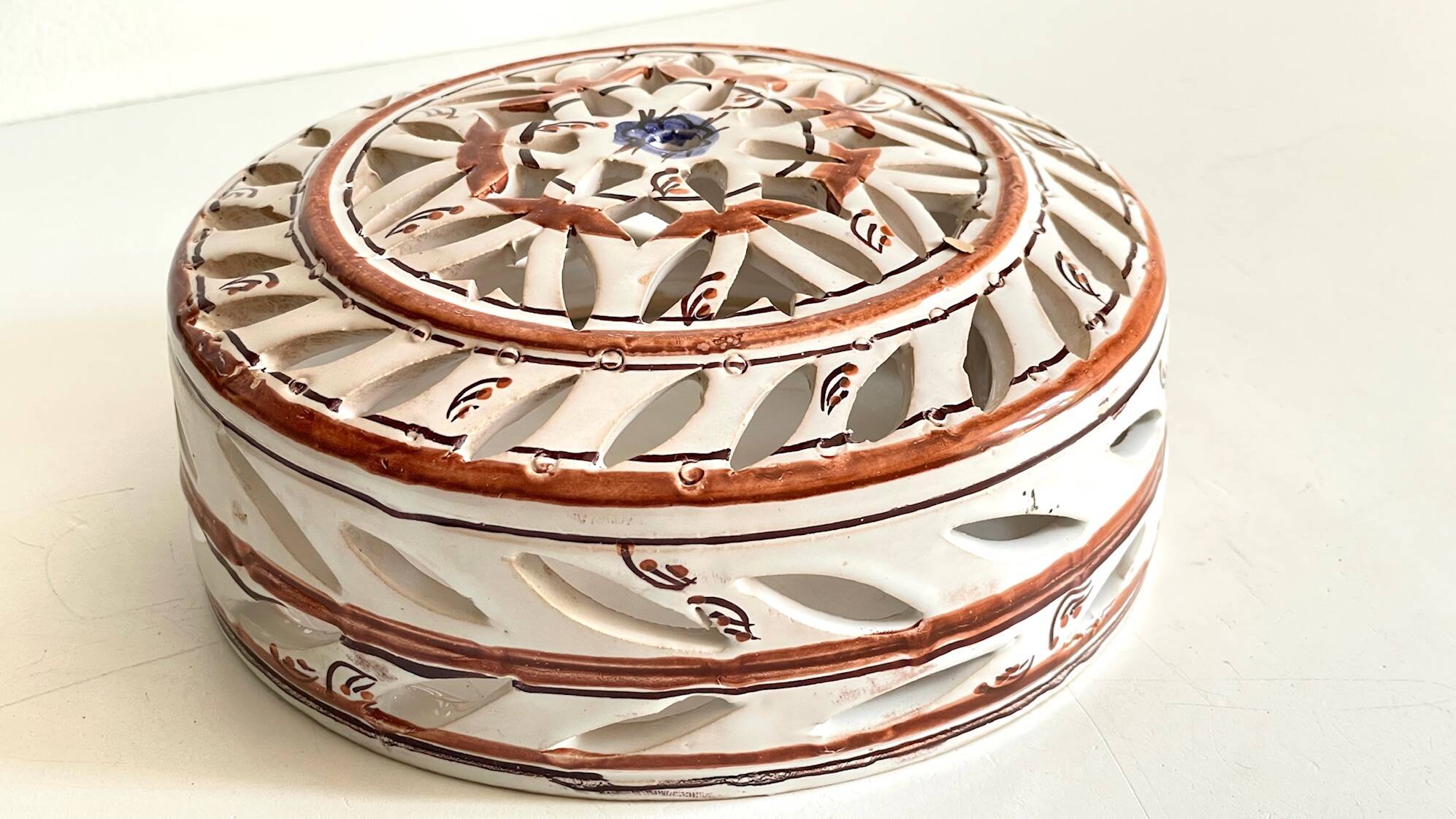 Handmade terracotta wall lamp with blue enamelled center