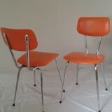 Duo of vintage chairs in orange skai