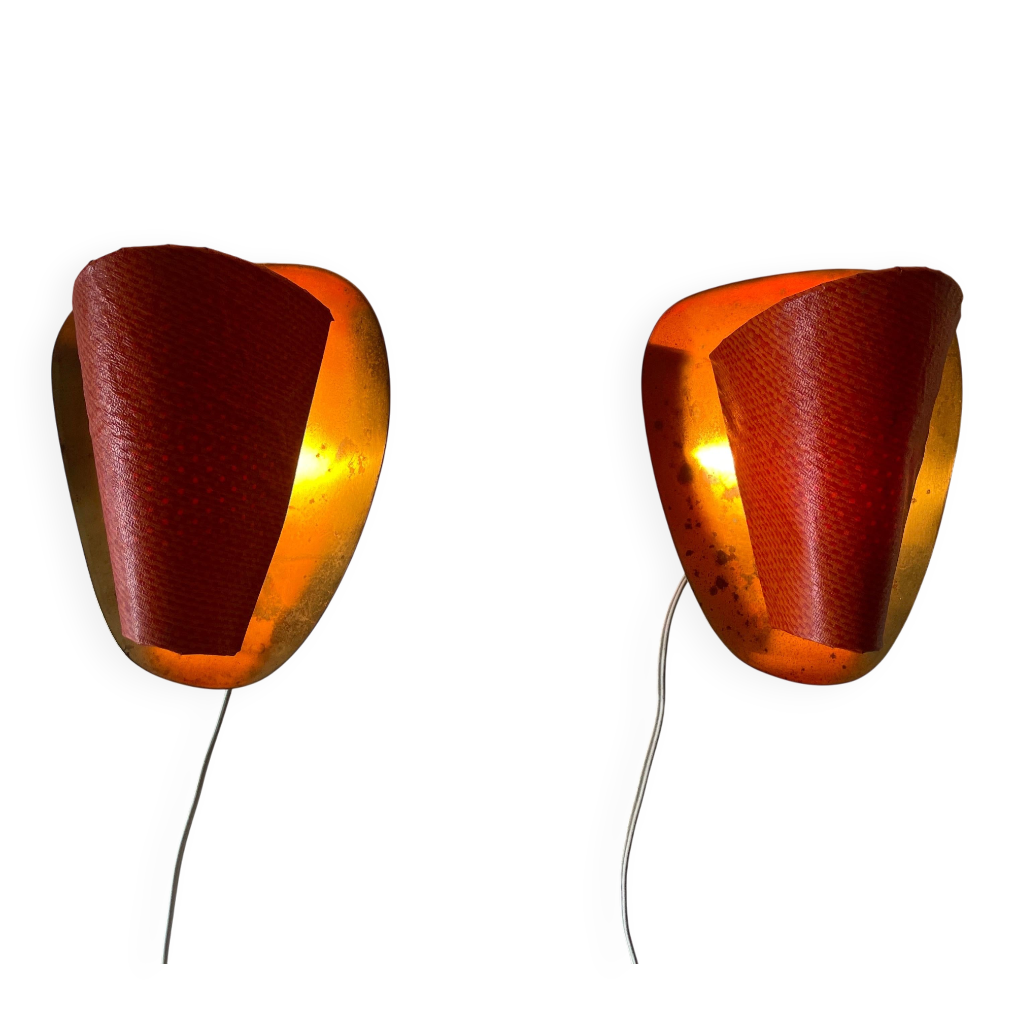 Pair of orange plexiglass and curved brass wall lights, 1950s, Germany