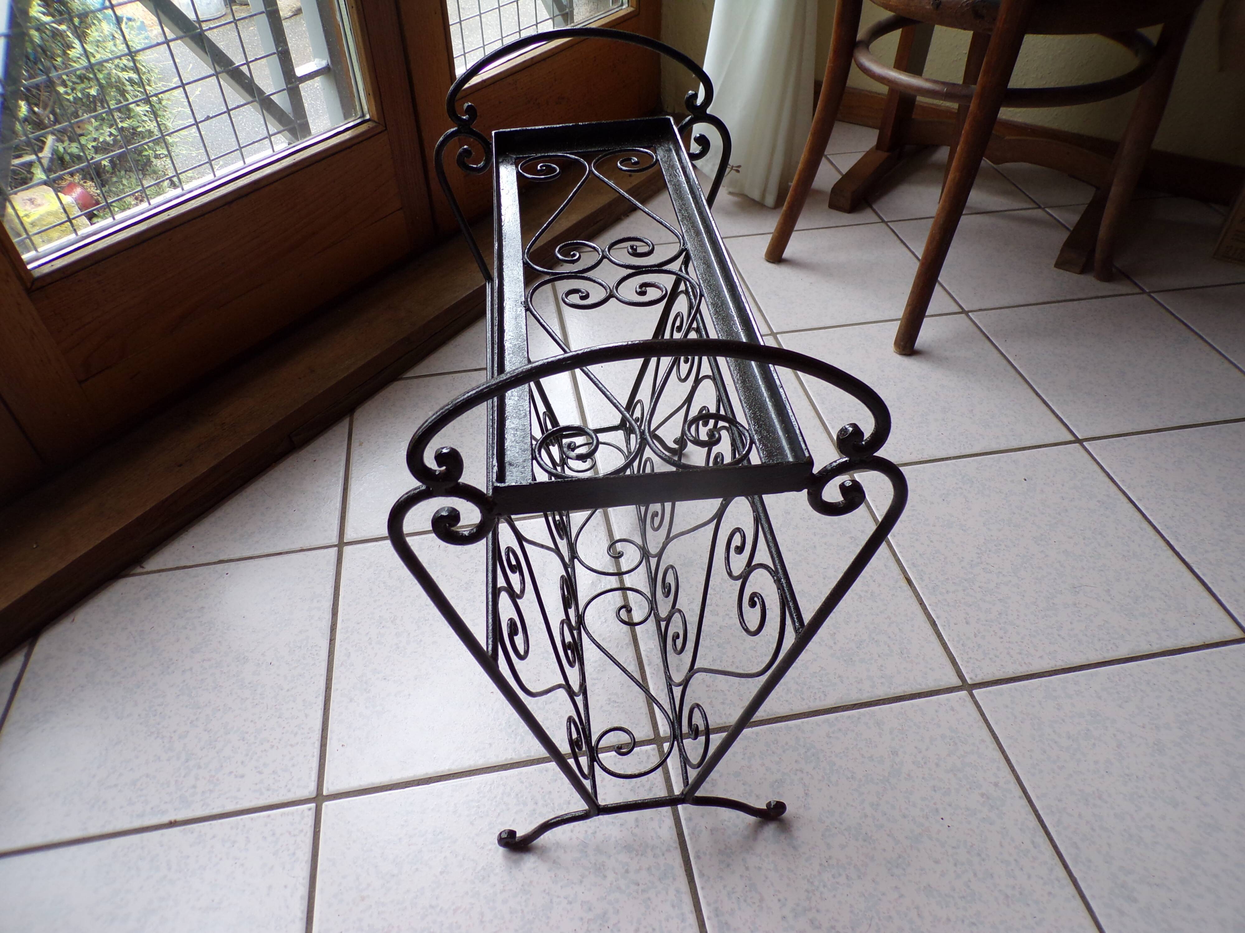Magazine holder and wrought iron plant