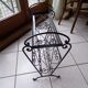 Magazine holder and wrought iron plant