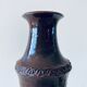 Tubular vase in glazed brown sandstone