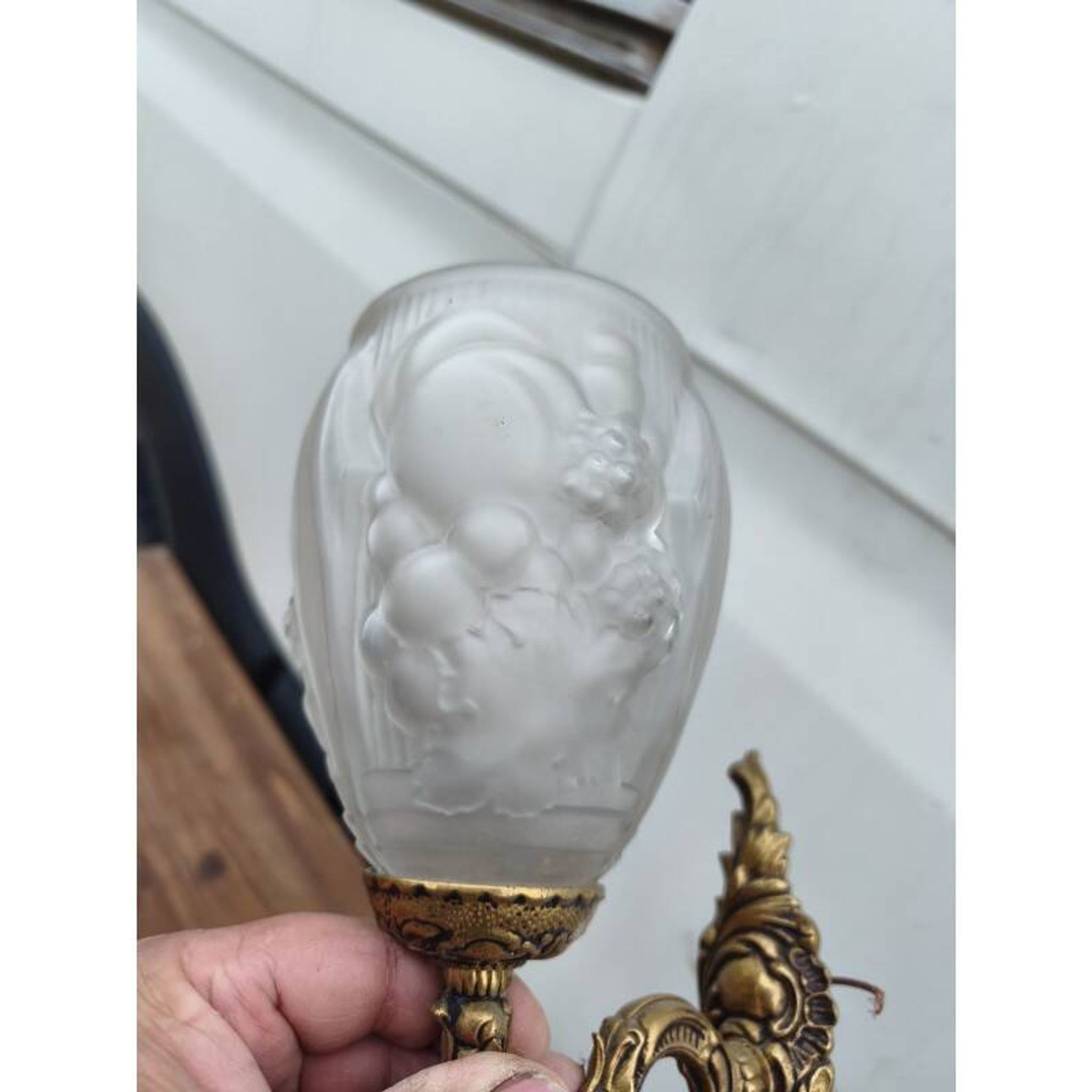 Pair of brass wall lights and glass paste.
