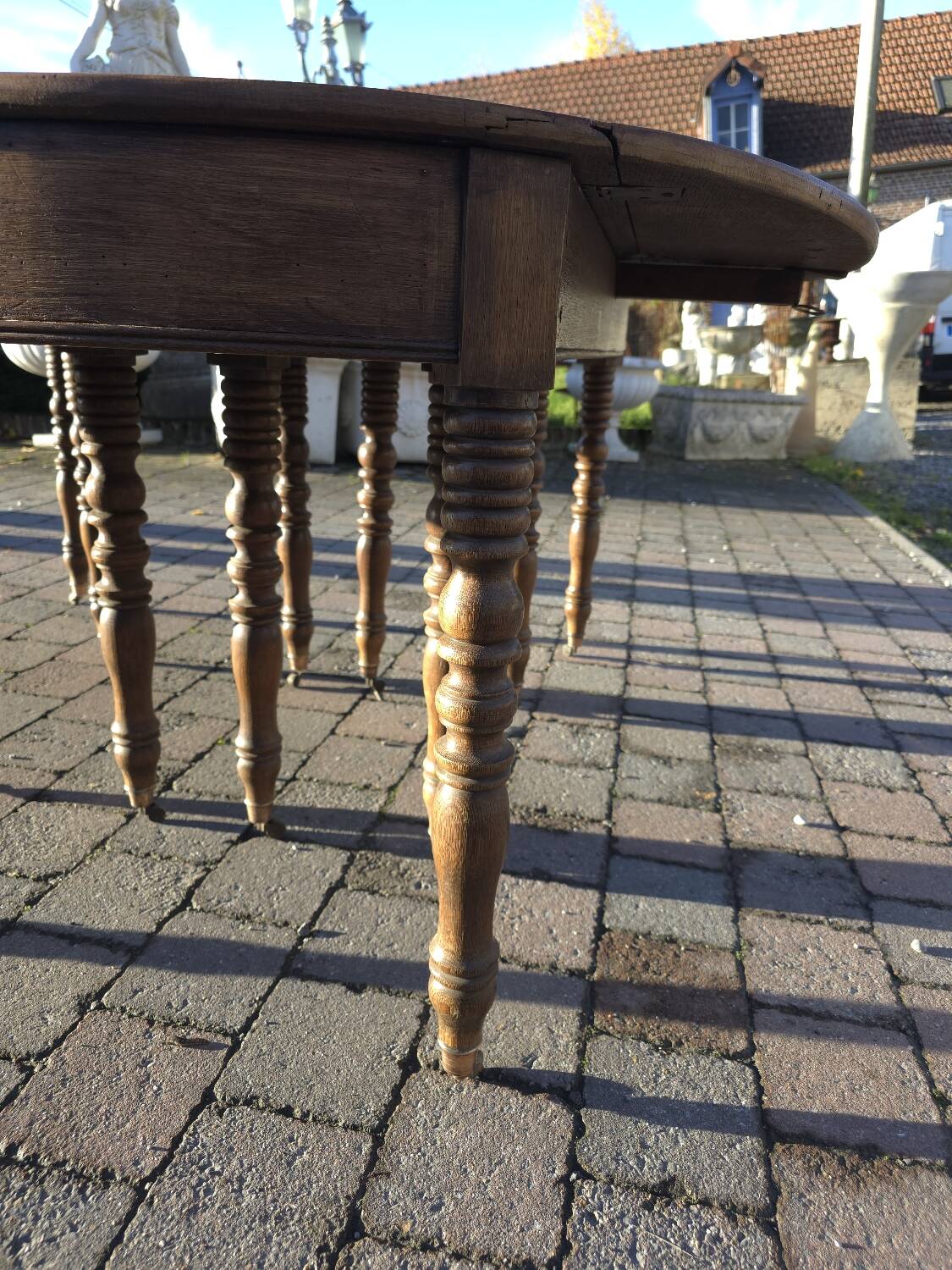 12-foot round oak table with 7 extensions / 20 people