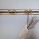 Patère en métal doré des années 50