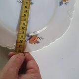 set of 4 dessert plates in white Limoges porcelain with flowers, the edge of one is different