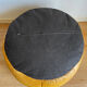 2 poufs moutarde patchwork en cuir de Sède