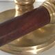 Pair of Scandinavian brass and teak candle holders