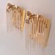 Pair of gold metal wall lights with tassels