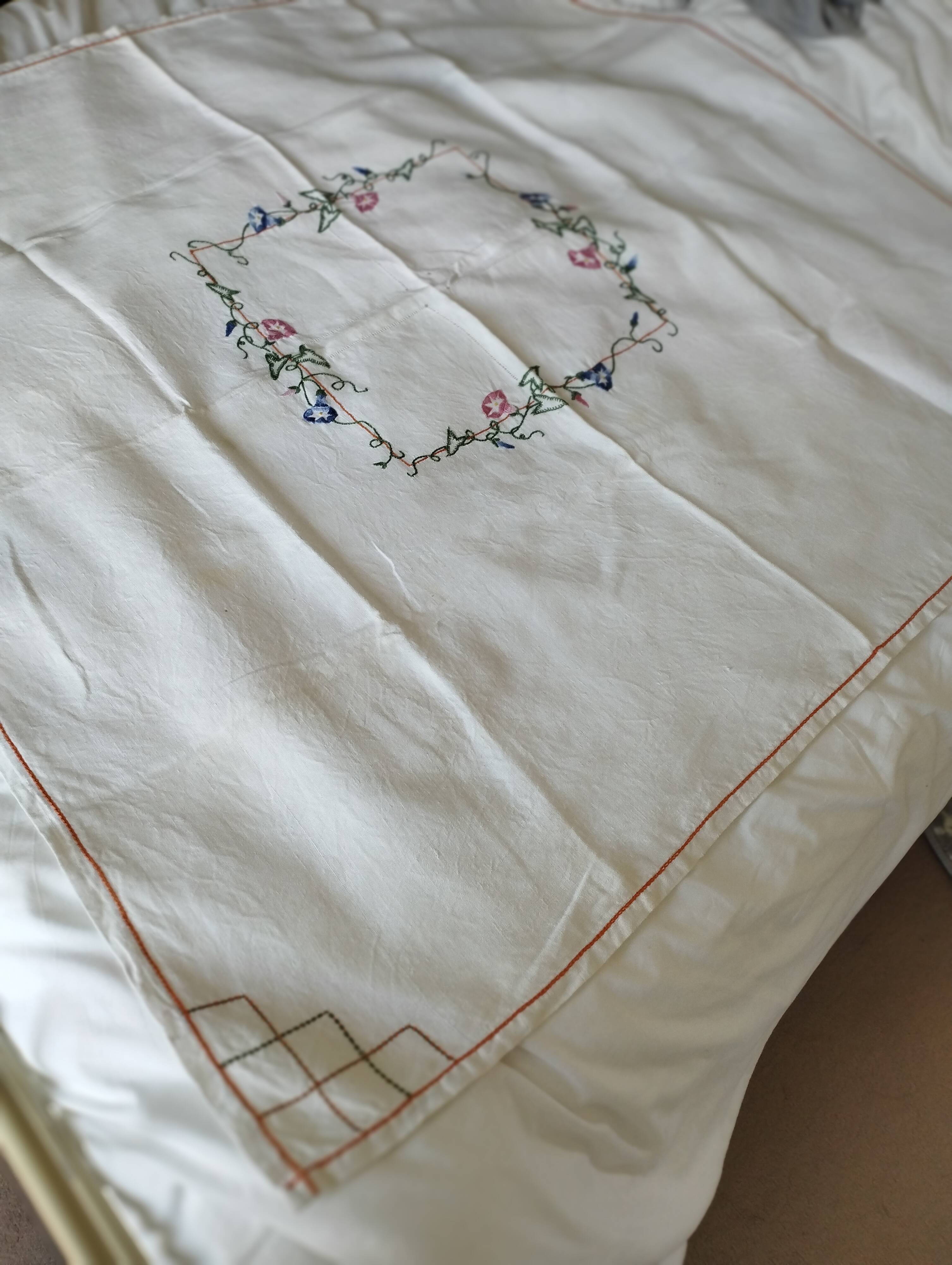 Antique linen tablecloth embroidered with flowers