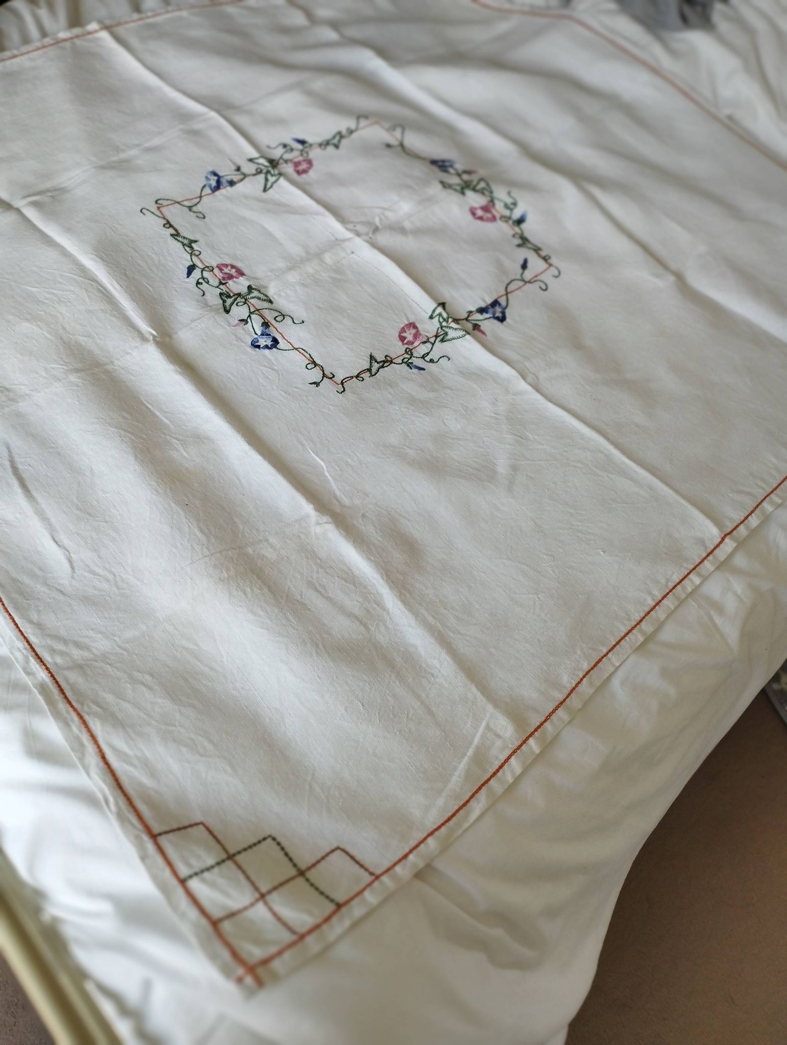 Antique linen tablecloth embroidered with flowers