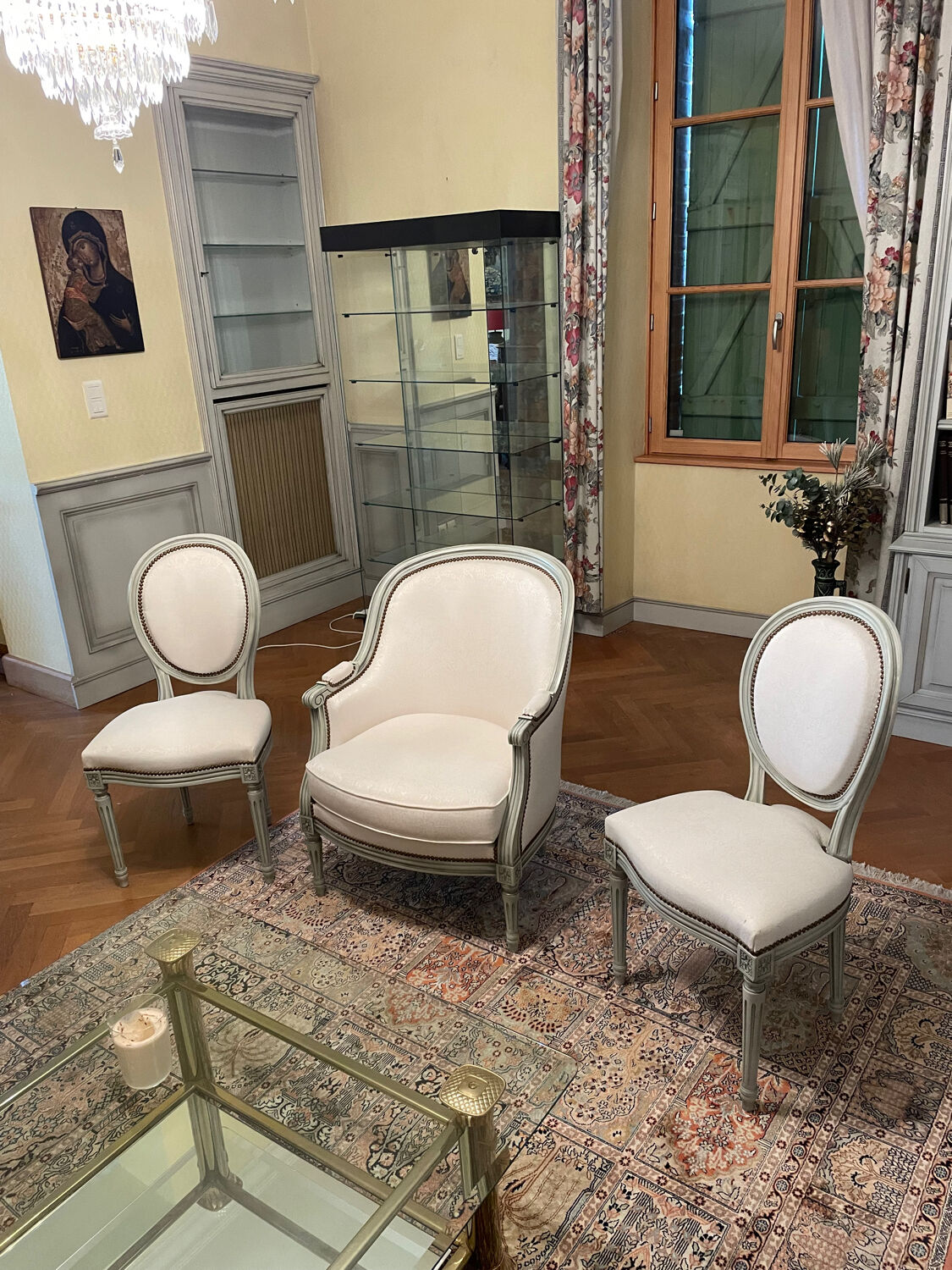 Armchair and 2 chairs set in Louis XVI style, light fabric, patinated wood.