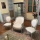 Armchair and 2 chairs set in Louis XVI style, light fabric, patinated wood.