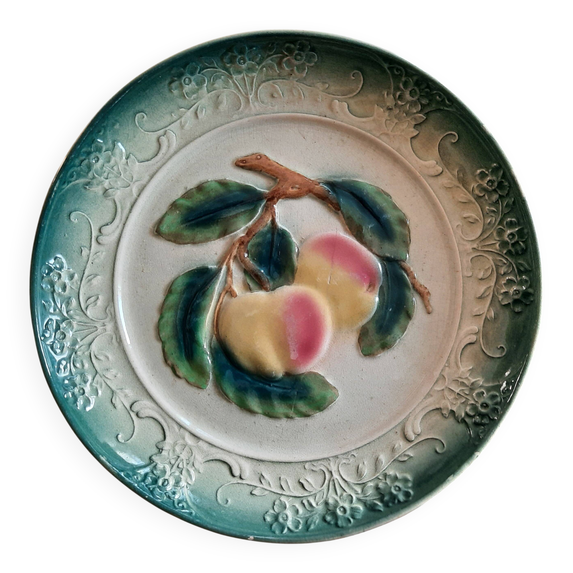 Decorative barbotine plate with apple design. Intended to be hung. Late 19th century.