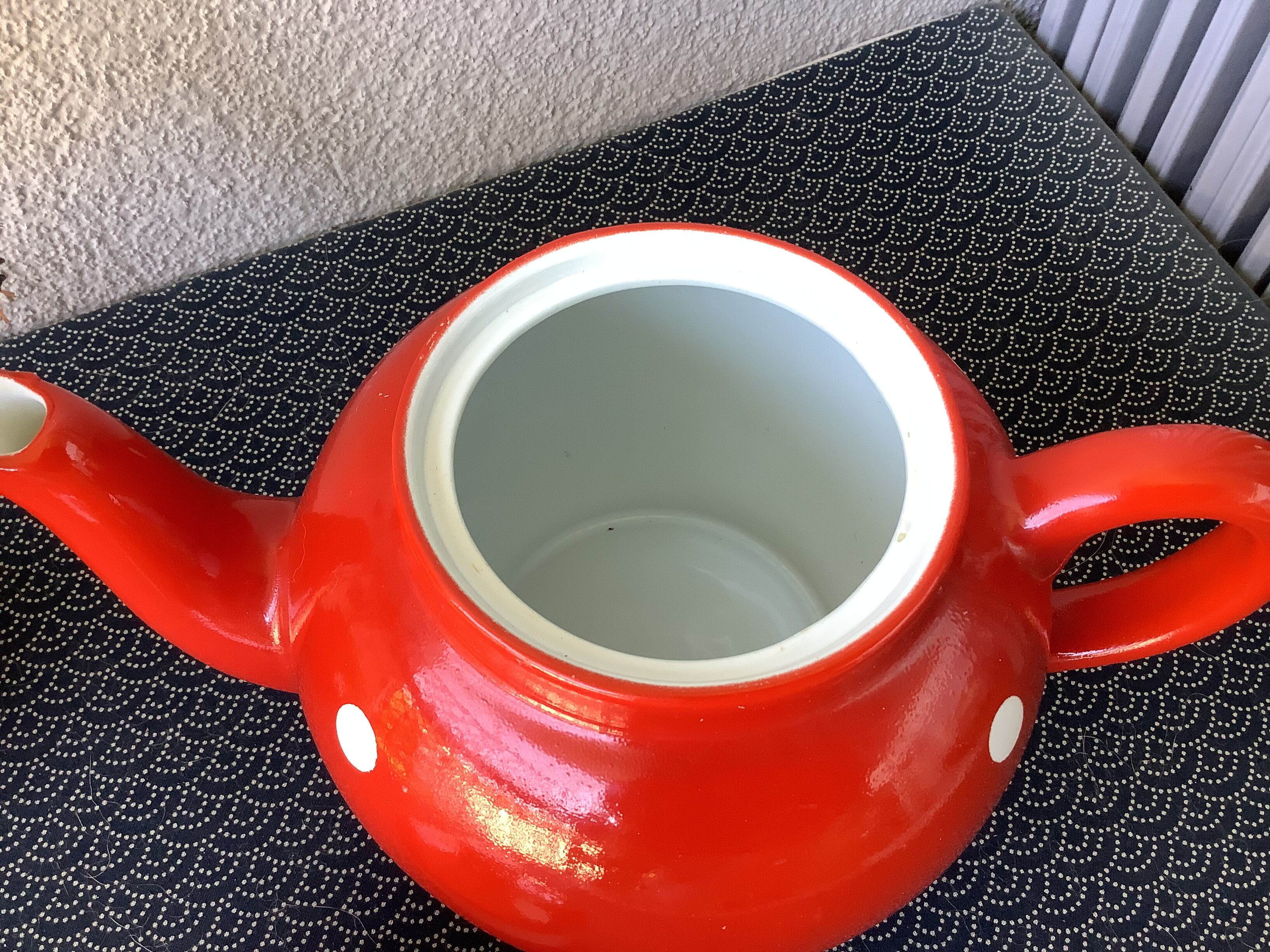 Vintage red teapot with white polka dots