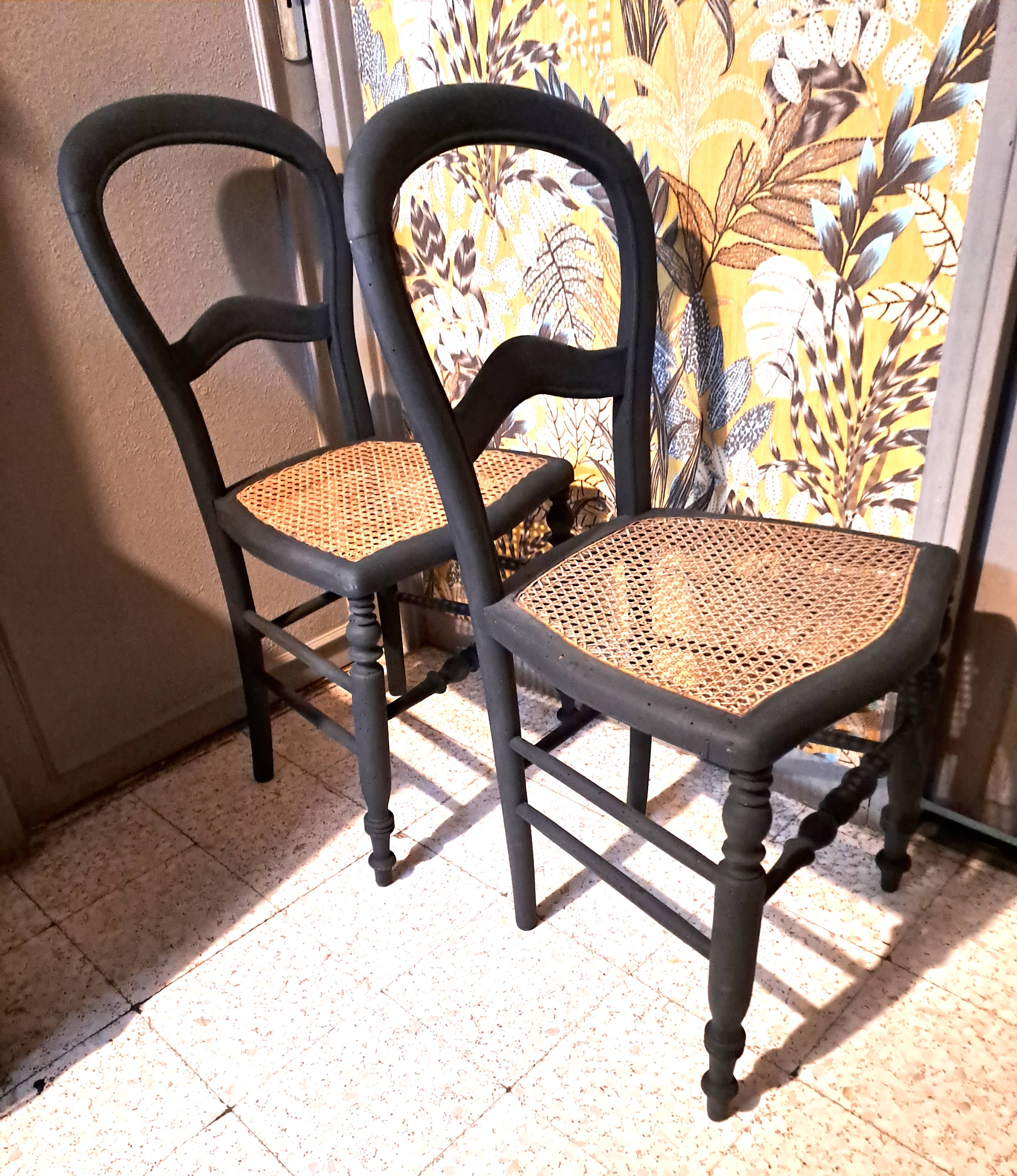 Pair of 2 chairs with cane seats in black wood, circa 1940
