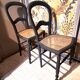 Pair of 2 chairs with cane seats in black wood, circa 1940