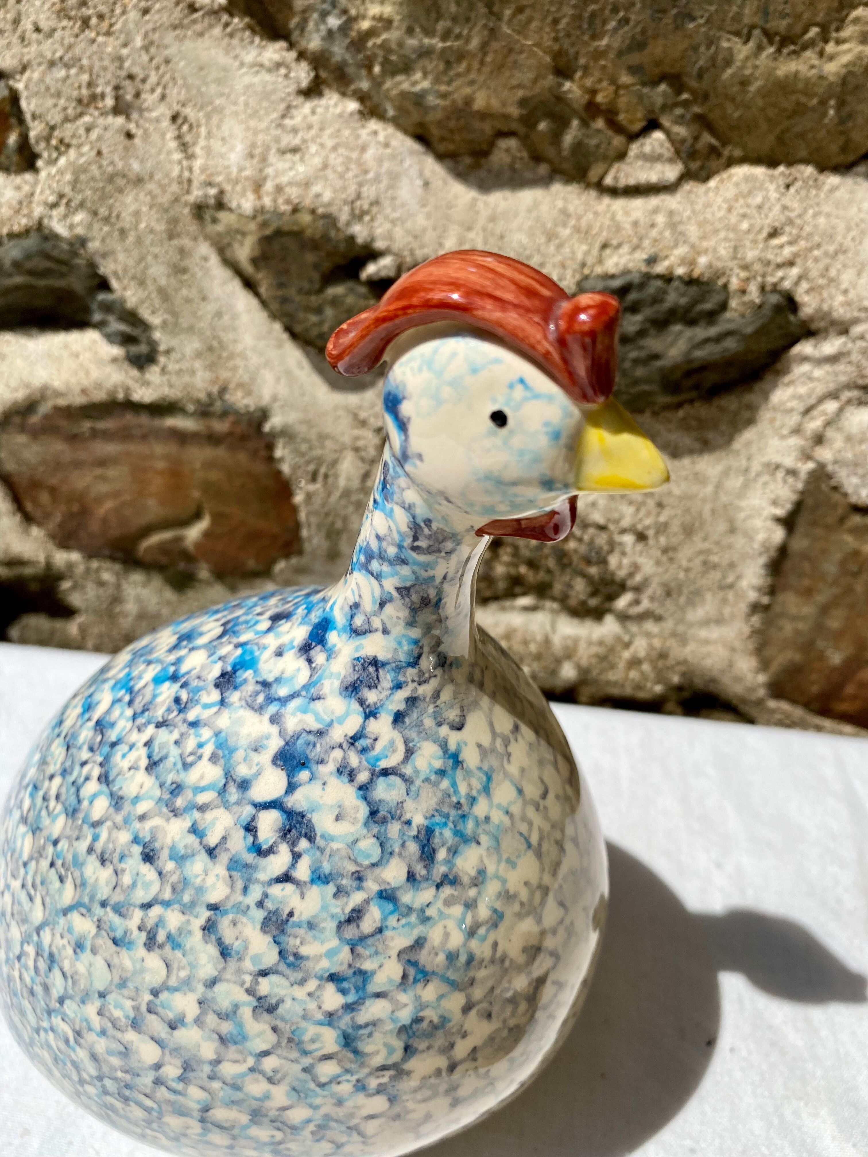 Signed ceramic hen and guinea fowl