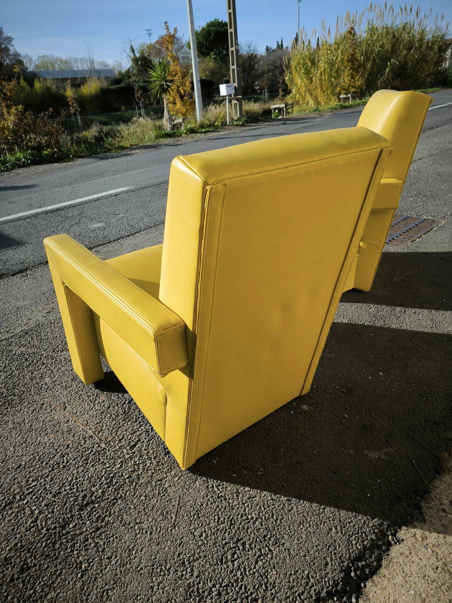 Pair of armchairs in sunny yellow leather