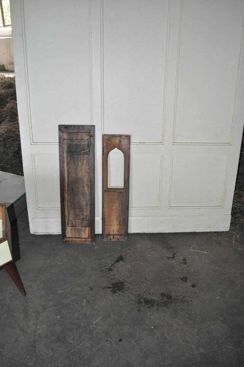 Set of 2 carved brown wooden panels, rural Hungary, 1940s, geometric patterns.