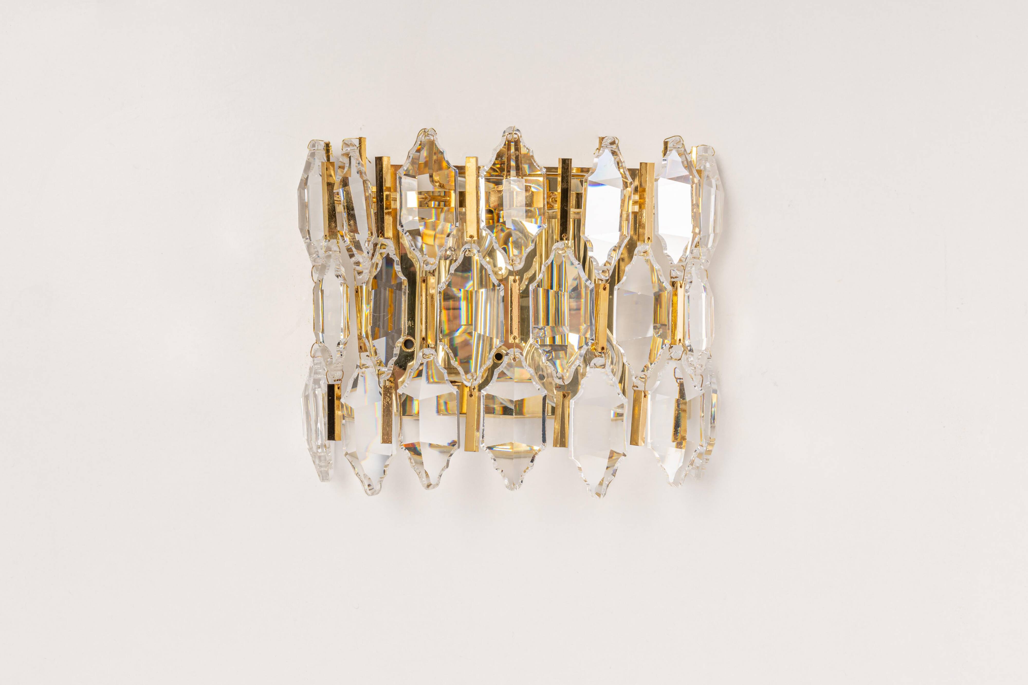 Pair of wall sconces in gilded brass and crystal by Palwa, Germany, 1970s.