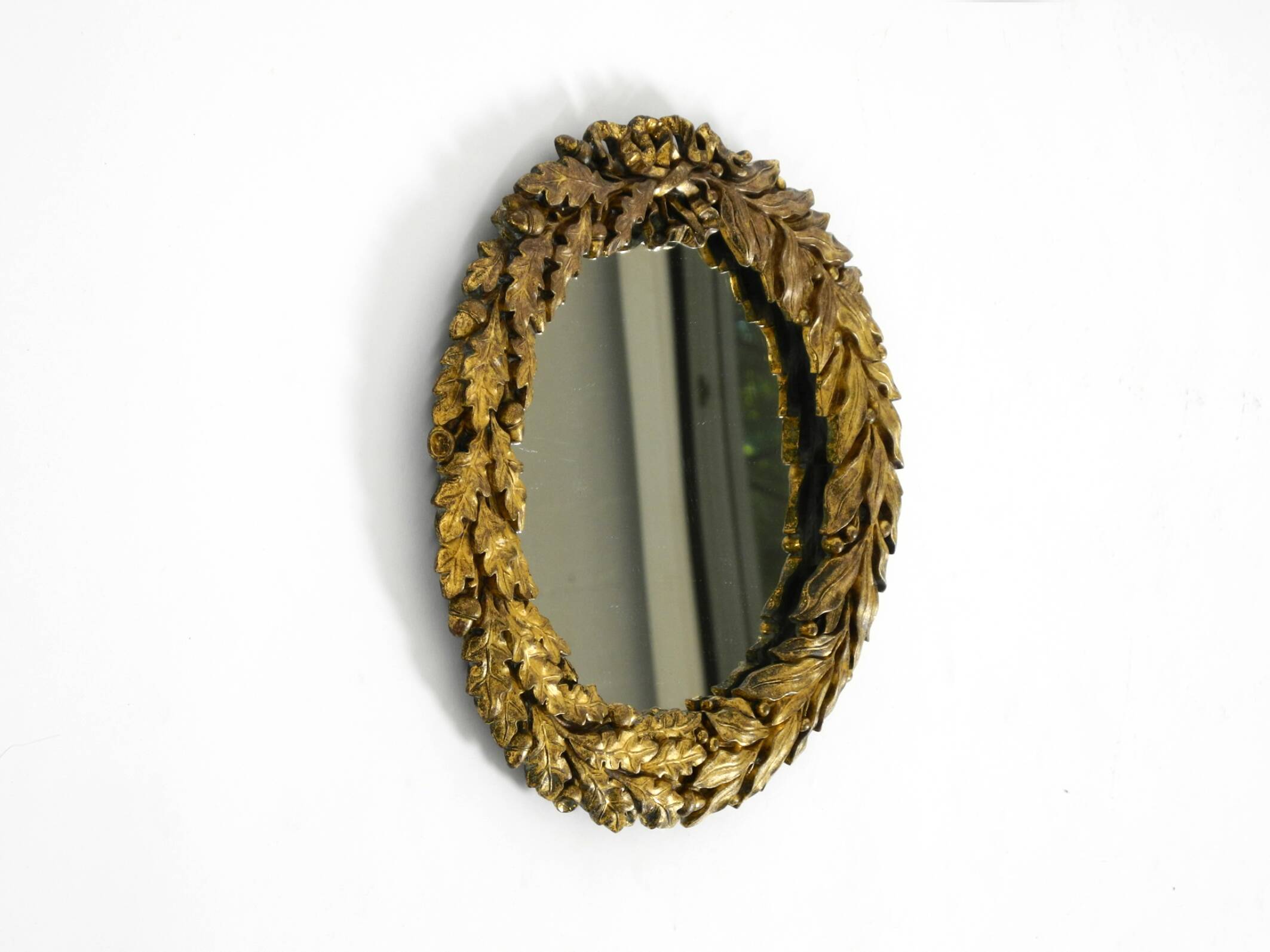 Beautiful small French mid-century wall mirror with an ornate brass frame