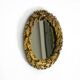 Beautiful small French mid-century wall mirror with an ornate brass frame