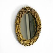 Beautiful small French mid-century wall mirror with an ornate brass frame