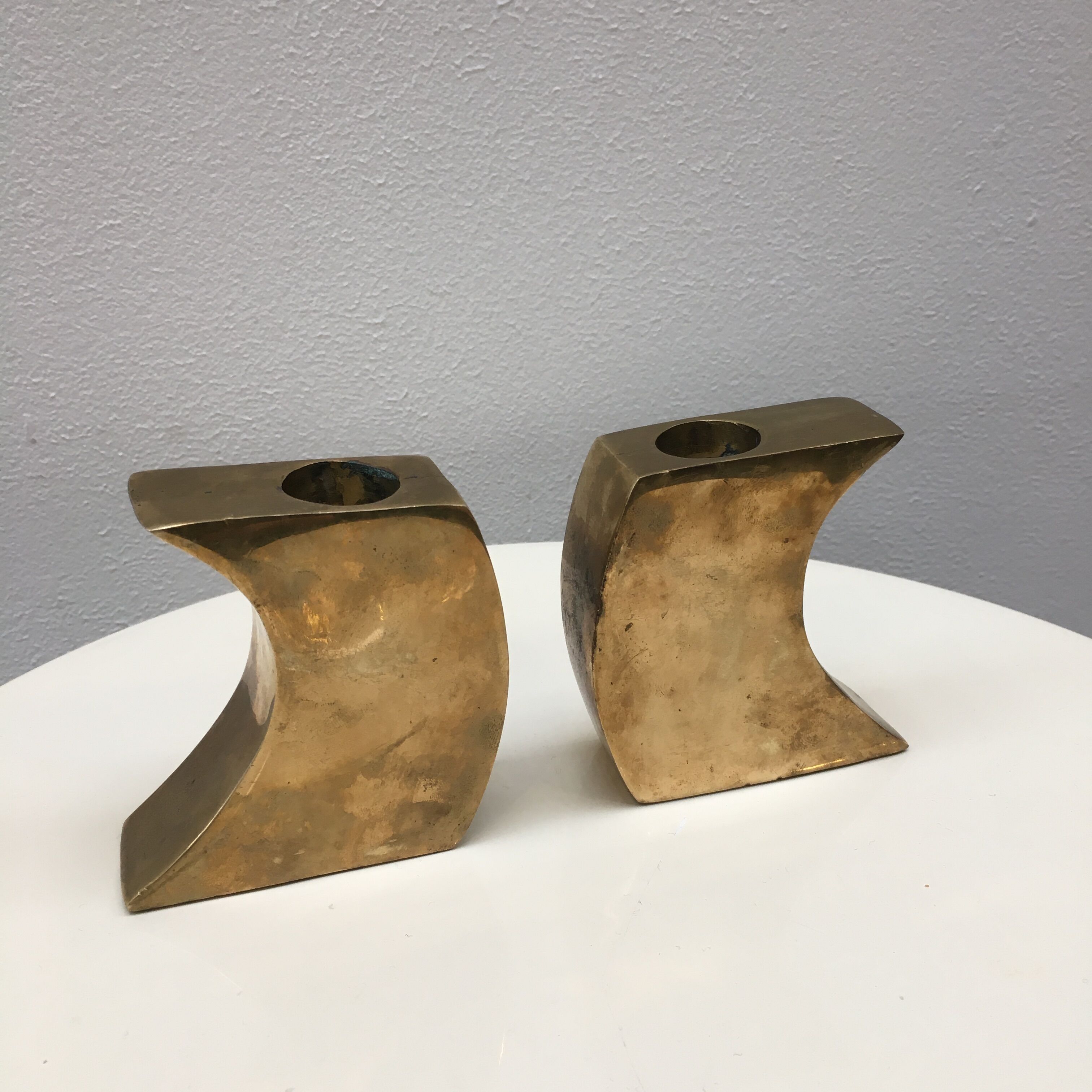 Pair of bronze candle holders by Monique Gerber