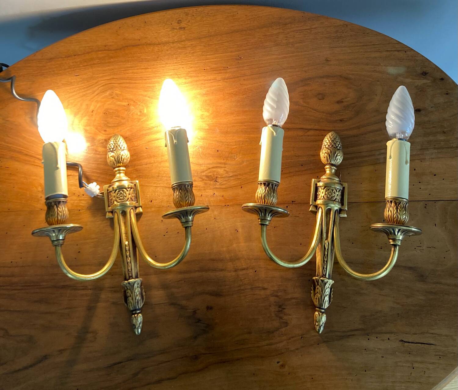 St Louis XVI gilded bronze wall lights with foliage and pine cone decorations